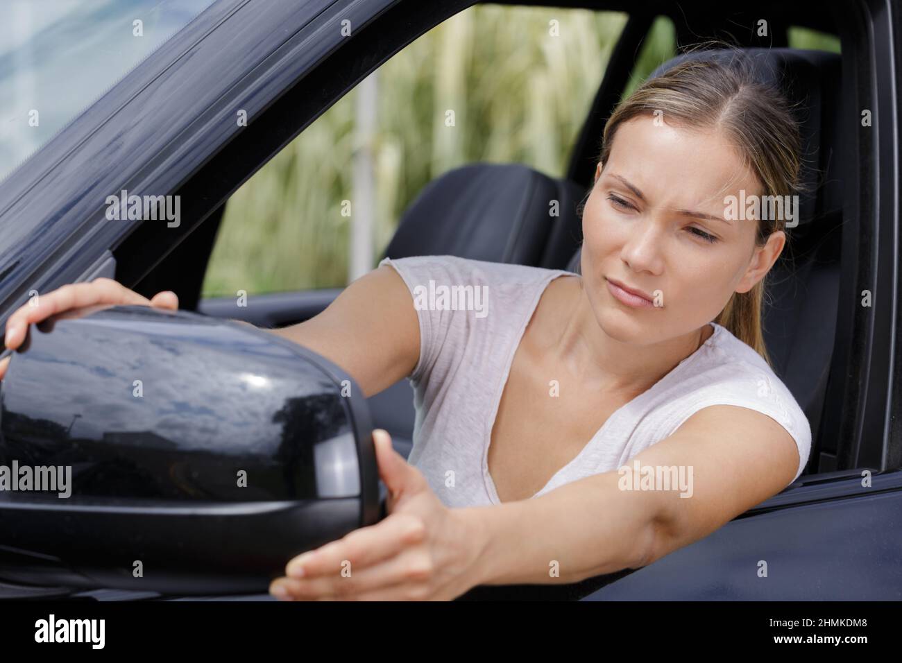 Woman adjusting car seat hi-res stock photography and images - Alamy