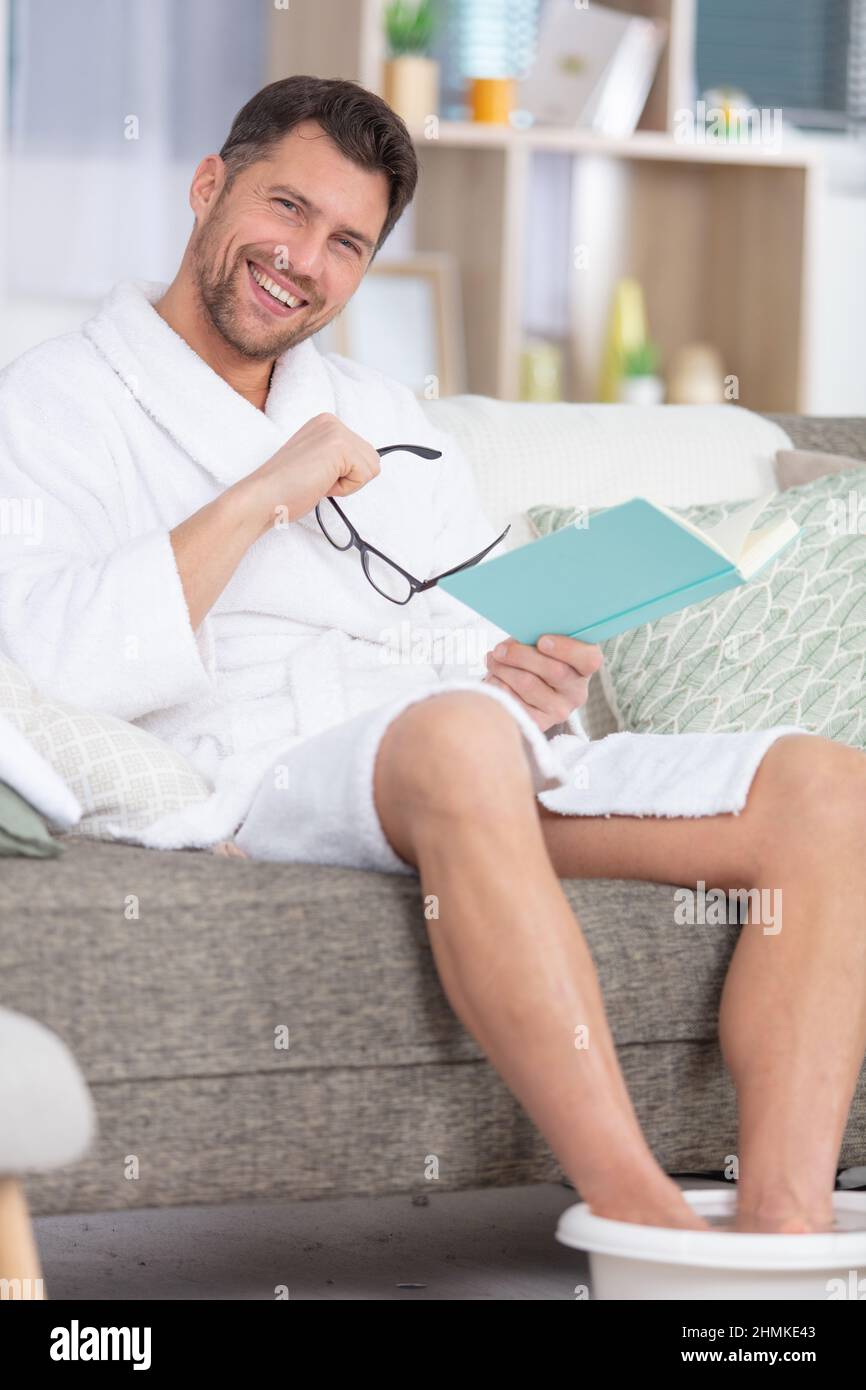 feet treatment in a foot spa tub mens pedicure Stock Photo Alamy