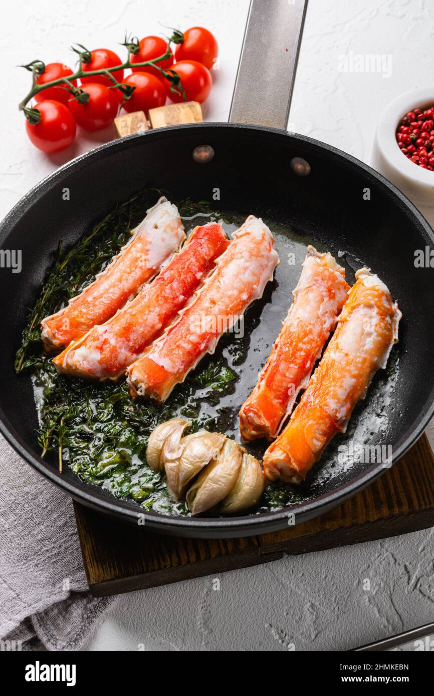Cooked Organic Alaskan King Crab Legs with Butter set, in cast iron
