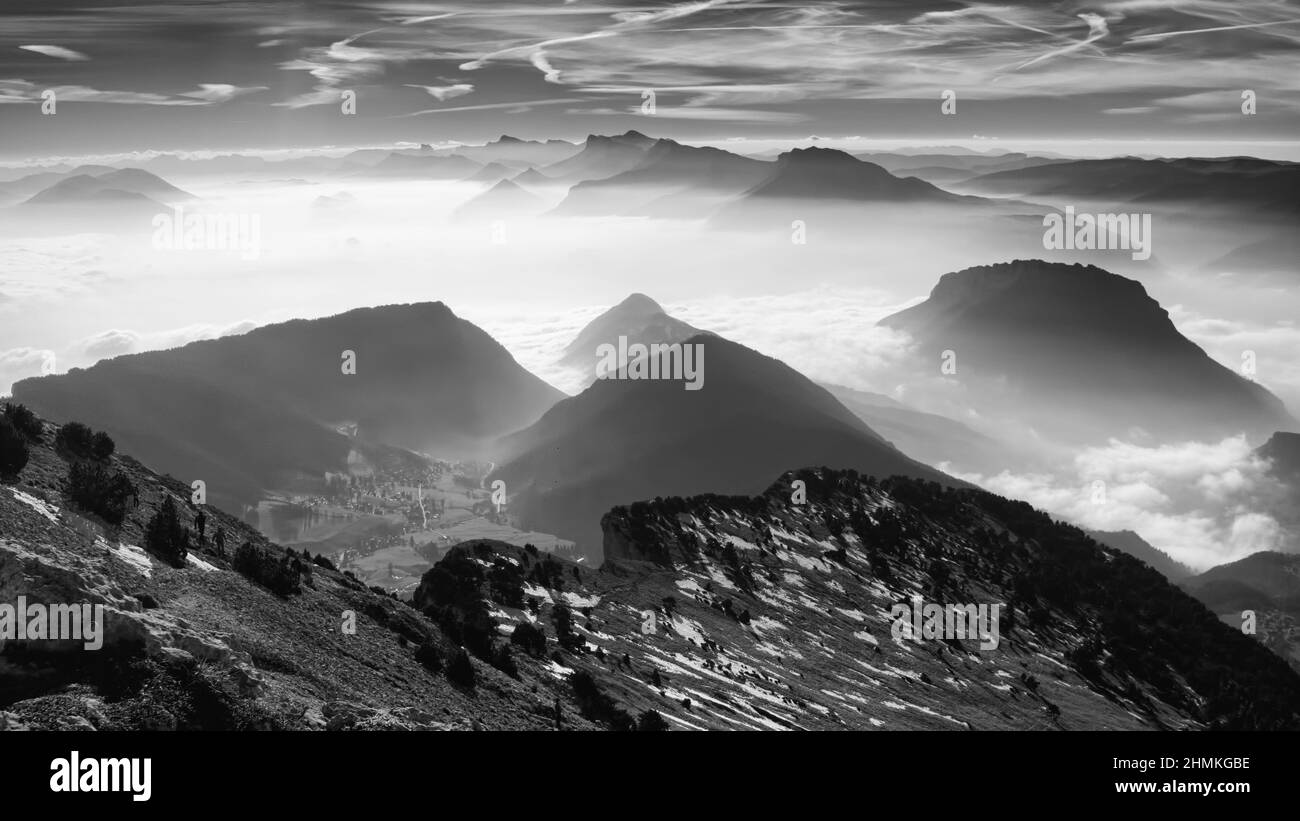 Grayscale of the beautiful misty valleys from Chamechaude, Isere Department, France Stock Photo