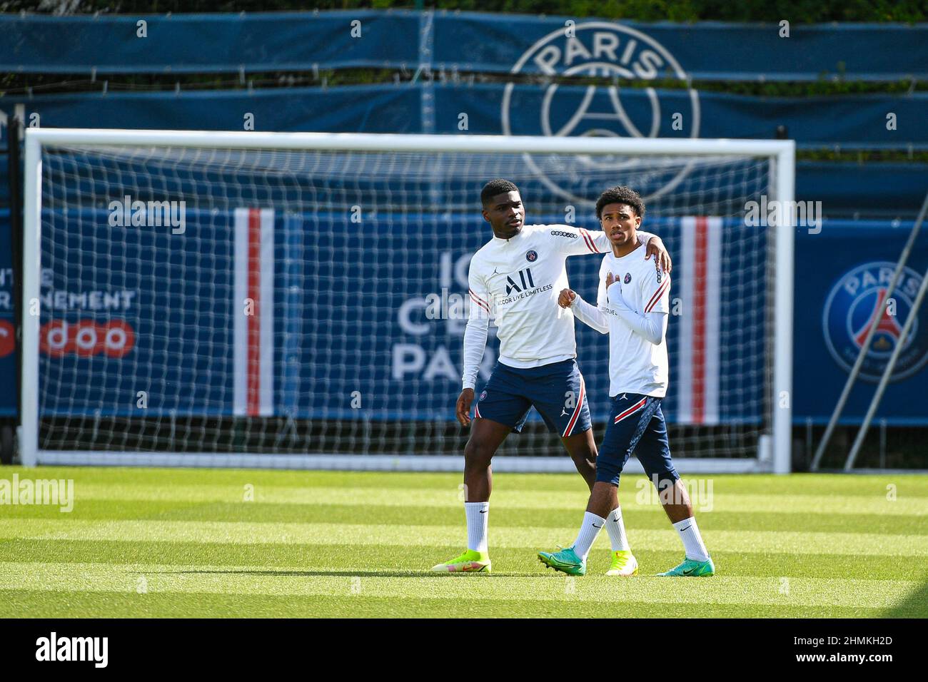 Junior Dina Ebimbe of PSG and Teddy Alloh of PSG during a training session at the Camp des Loges Paris Saint-Germain football club's training ground i Stock Photo