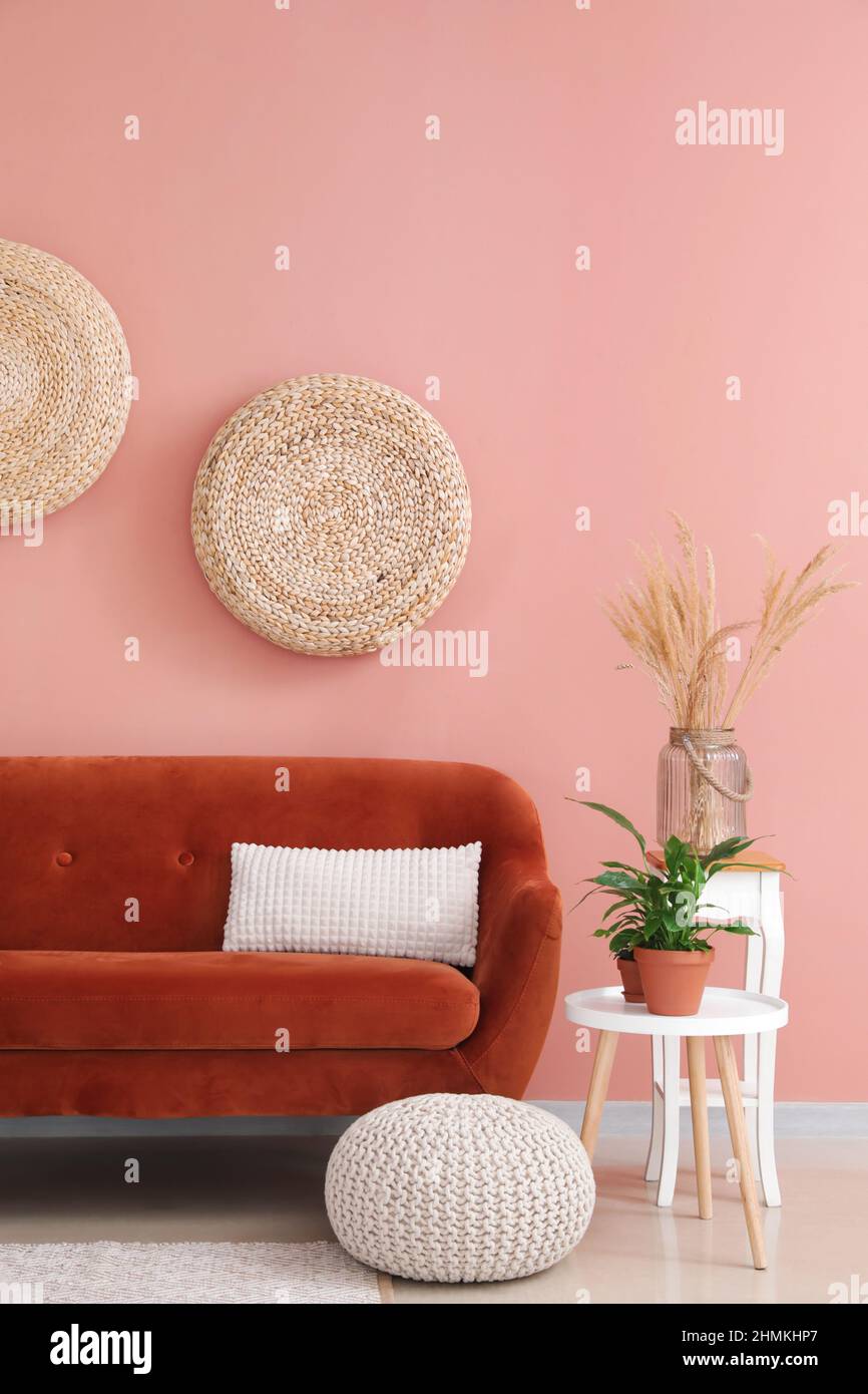 Stylish orange sofa in modern interior of living room Stock Photo - Alamy