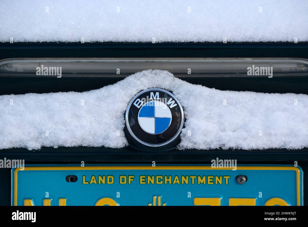 BMW badge covered in snow Stock Photo - Alamy
