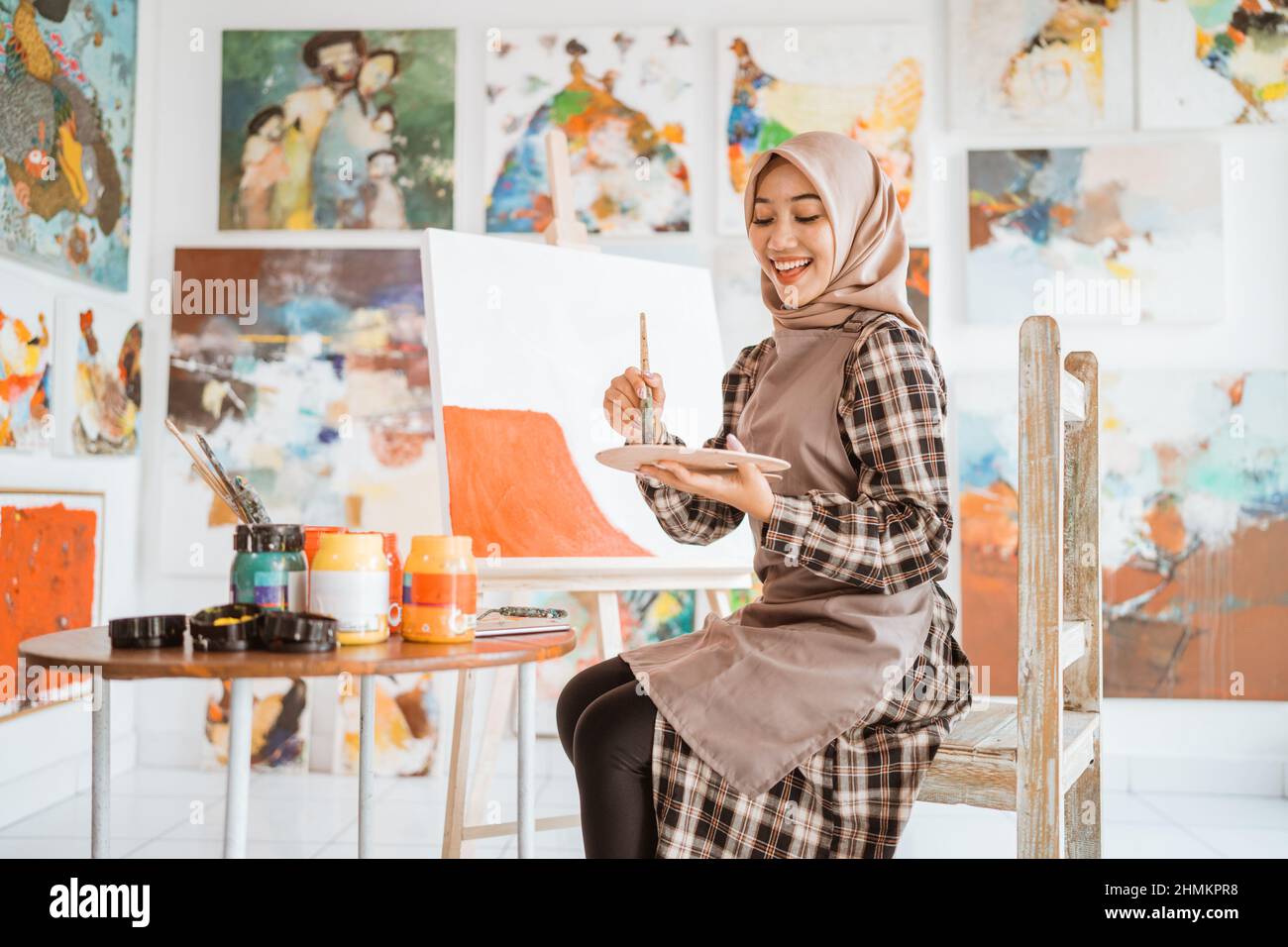 Muslim asian female artist painting hi-res stock photography and images ...