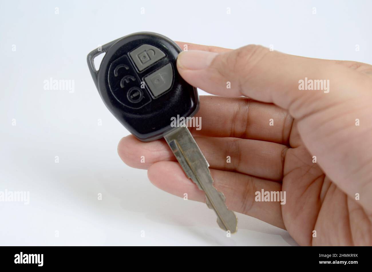 hand holding car key. Immobilizer. Isolated in White background Stock