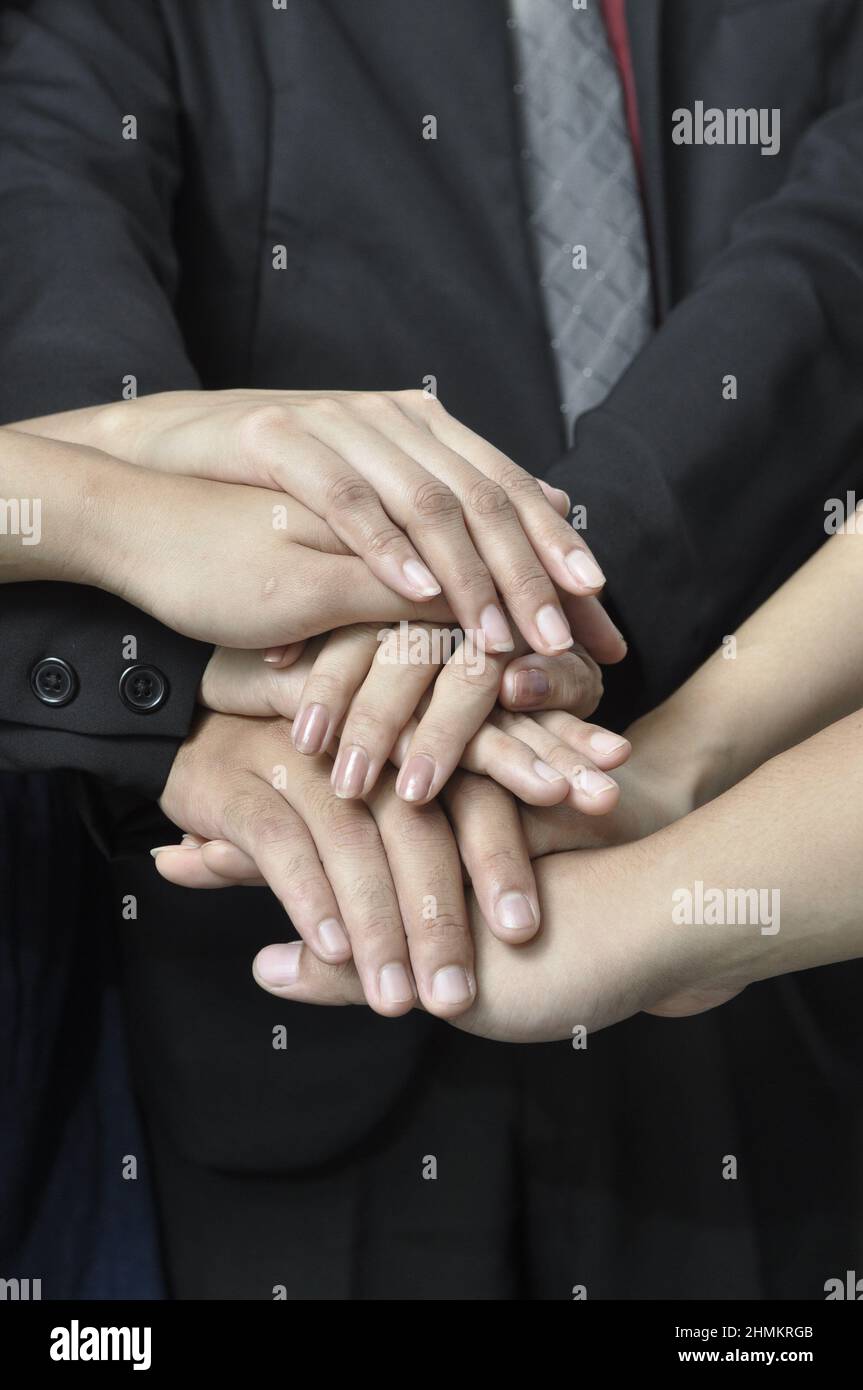 conceptual hand for team work, working together, business Stock Photo