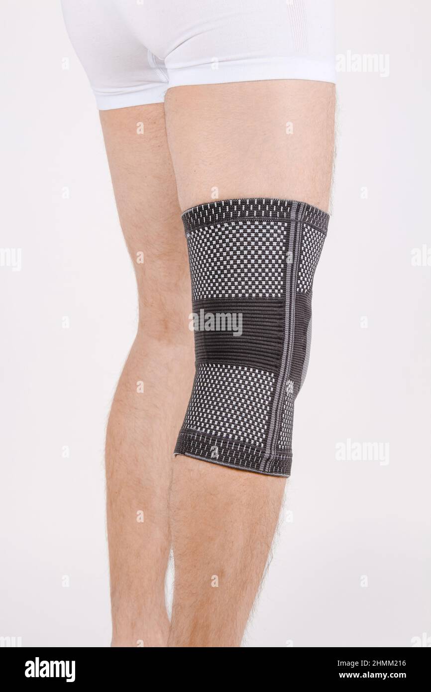 Knee Support Brace on leg isolated on white background. Elastic