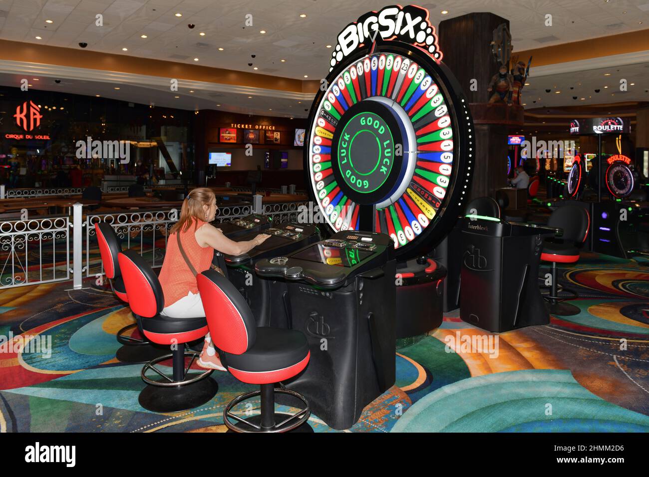 Nevada USA 09-5, 2021 Sitting in front of a gaming machine, a lady pays her full attention to roulette in the casino area of the MGM Grand Las Vegas Stock Photo