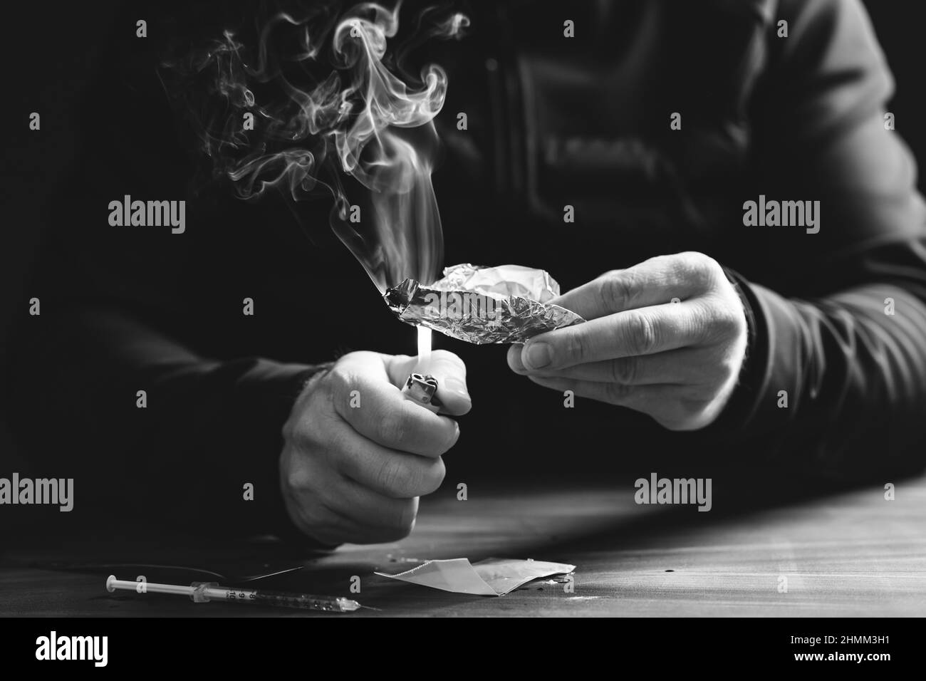 Addict/junkie man preparing drugs. The concept of crime and drug addiction Stock Photo Alamy