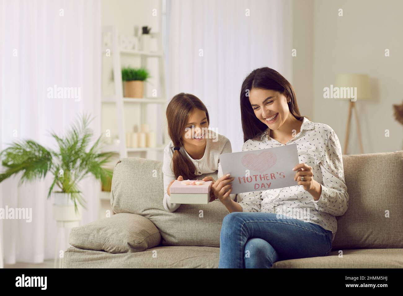 Happy small daughter congratulate mum with mothers day Stock Photo