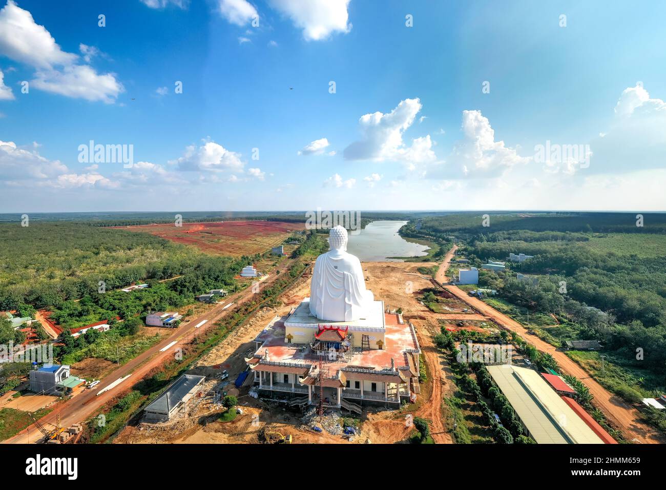 Quoc Van Thanh Buddhist Temple - December 26, 2021: Aerial view of the largest sitting Buddha statue in Southeast Asia in Binh Long district, Binh Phu Stock Photo
