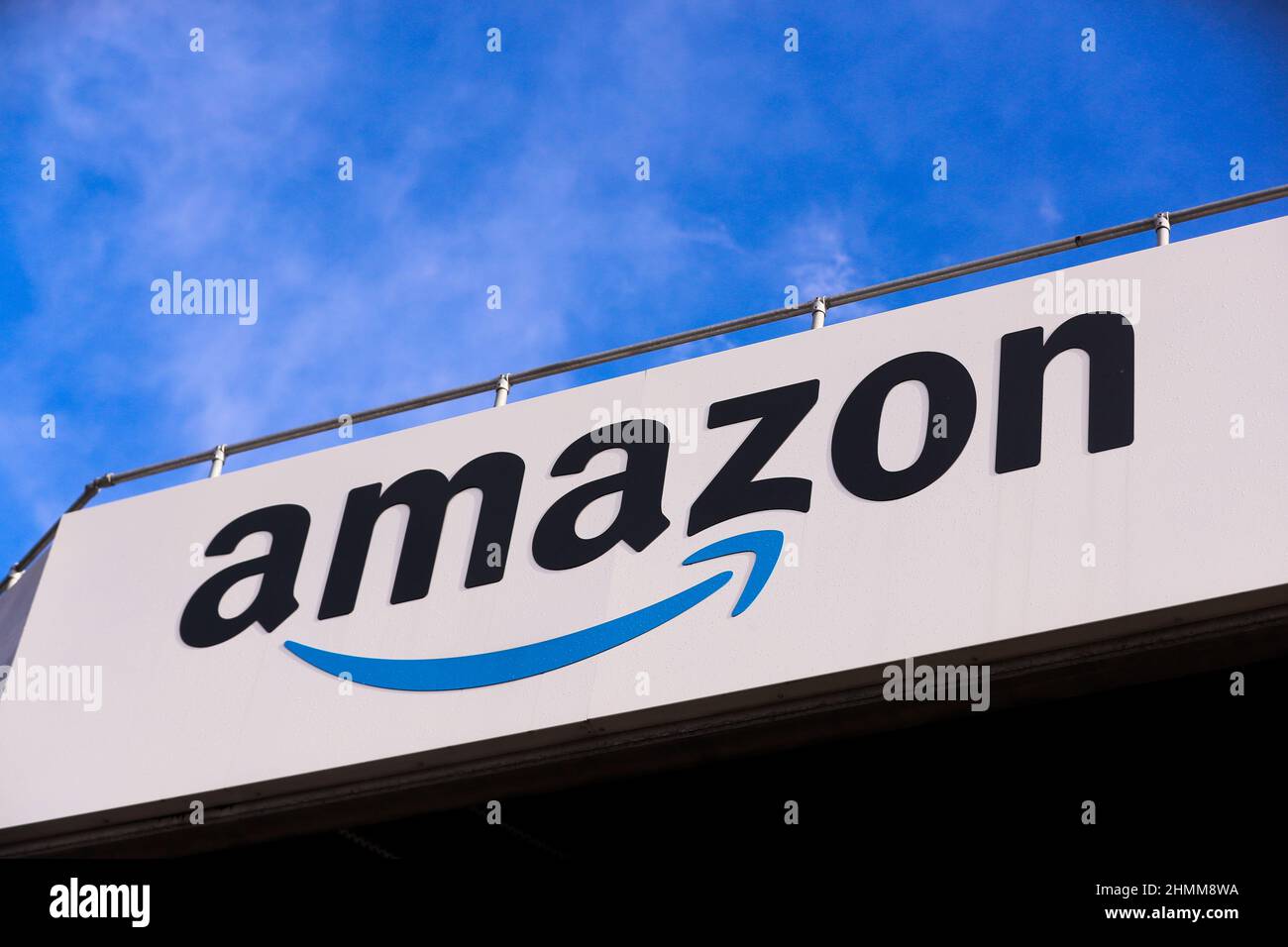 Amazon logo and signage at their disruption and delivery hub in Belfast, Northern Ireland. Stock Photo