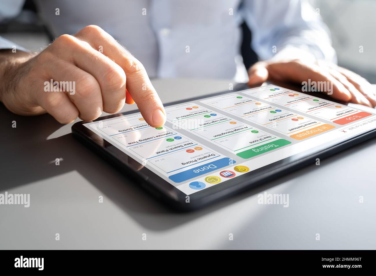 Scrum Project Manager Using Scrum Board Scheduling Software Stock Photo