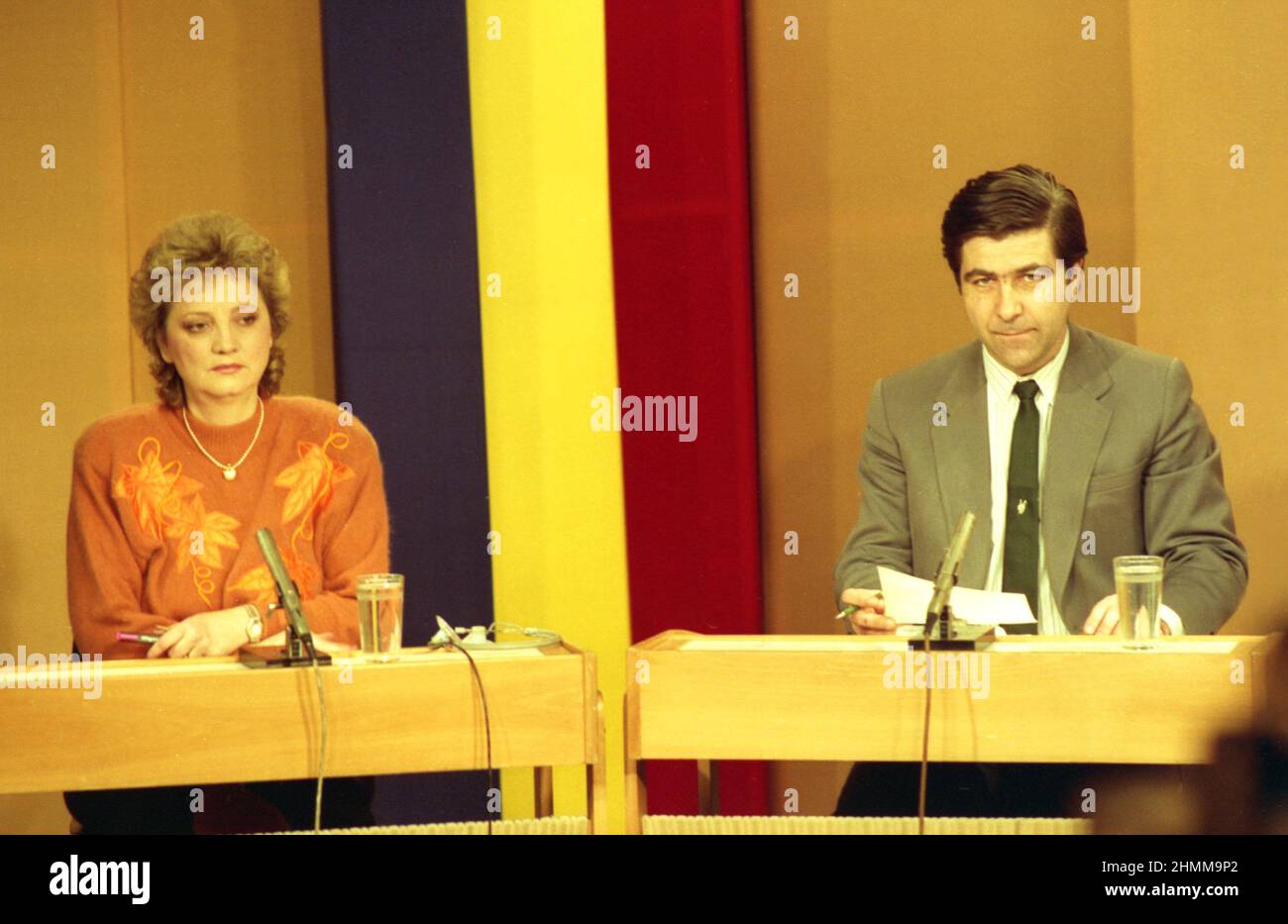 Romanian Television, Bucharest, Romania, January 1990. News anchor Felicia Meleșcanu & Nicolae Melinescu during a live transmission. Stock Photo