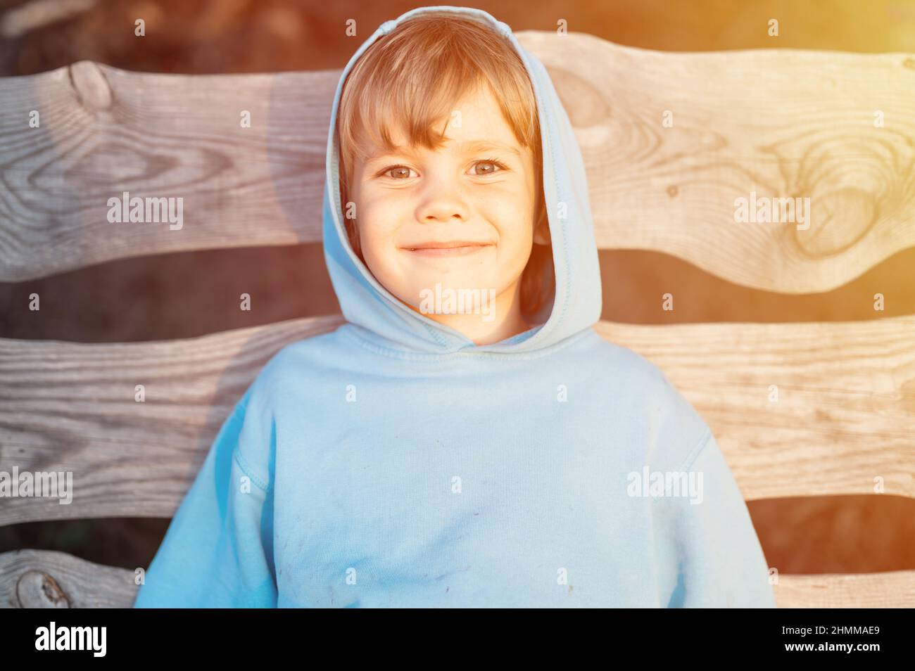 portrait of face happy smiling candid five year old kid boy in blue