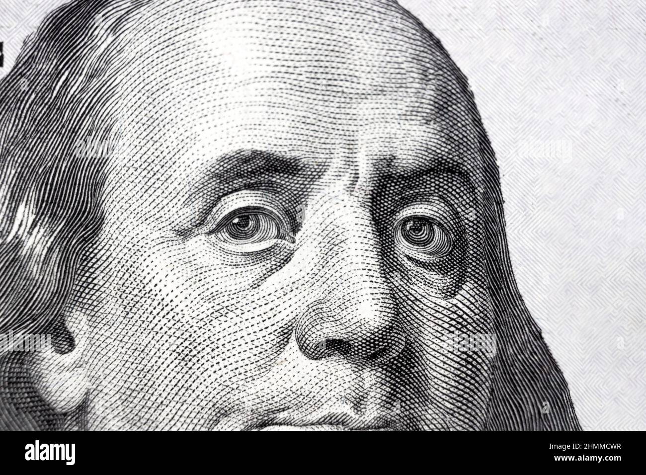 One hundred dollars bill fragment with the portrait of president Benjamin Franklin. Close up of American currency Stock Photo