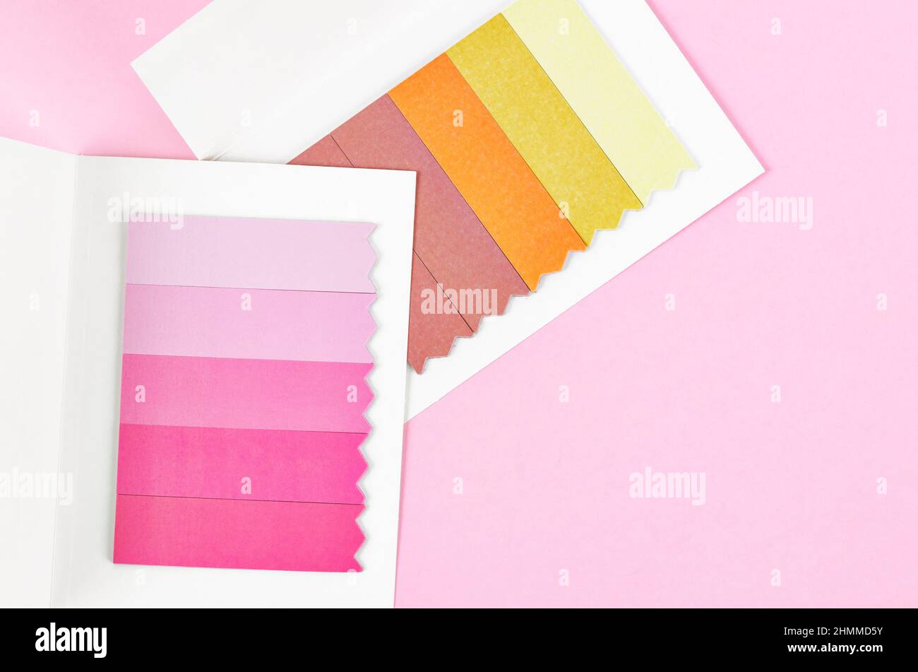 Set of multicolored sticker paper index on pink background. Stock Photo