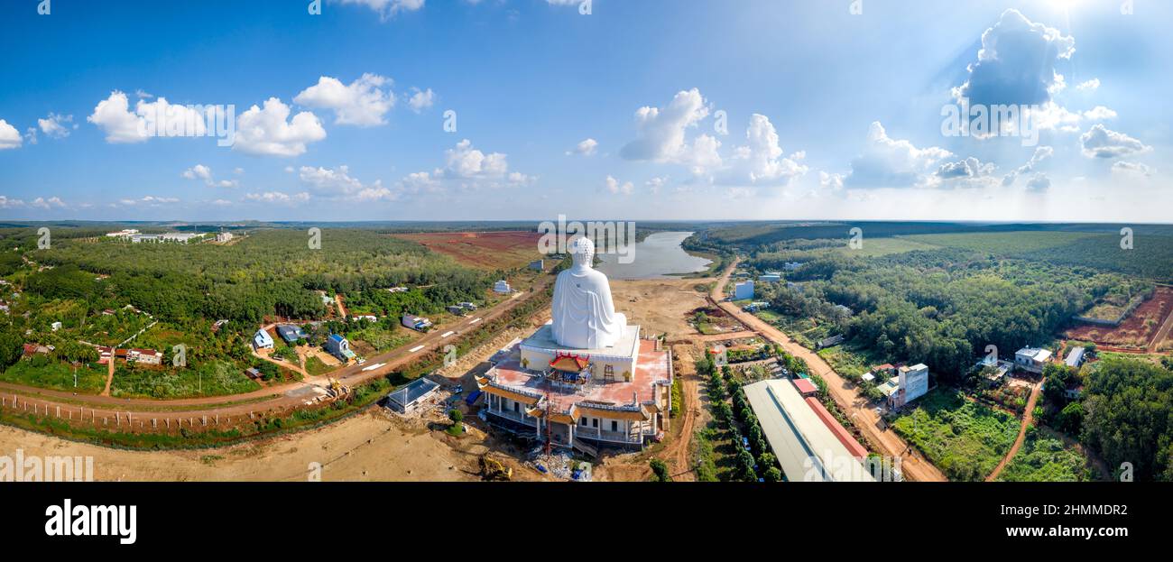 Quoc Van Thanh Buddhist Temple - December 26, 2021: Aerial view of the largest sitting Buddha statue in Southeast Asia in Binh Long district, Binh Phu Stock Photo