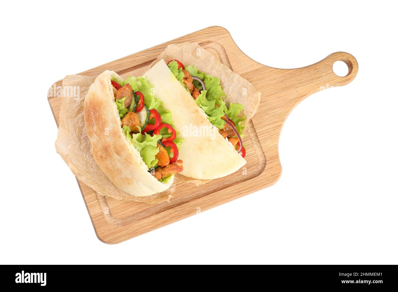 Board with pitas with chicken isolated on white background Stock Photo