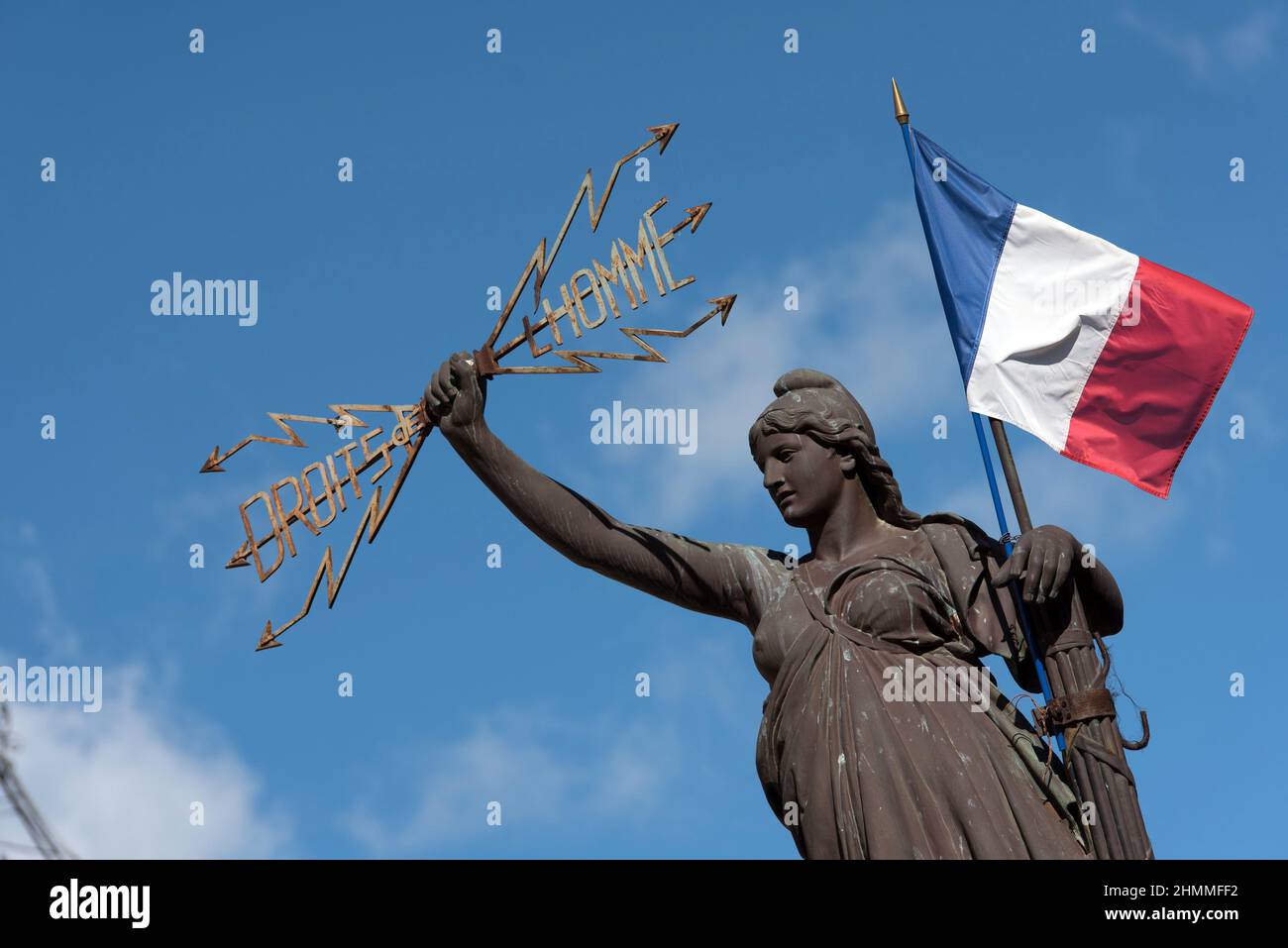 Pezenas (south of France): place de la Republique square, statue of Marianne holding a French tricolour flag and inscription Droits de l'Homme (Human Rights). Stock Photo