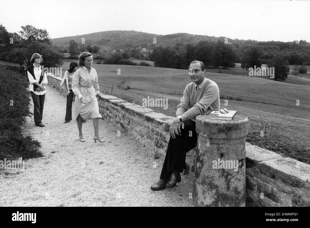 Jacques Chirac on August 30, 1976, after his resignation as Giscard d'Estaing's Prime Minister, resignation announced on August 25, 1976. Jacques Chirac relaxing at the Ch‰teau de Bity in Sarran, with his wife Bernadette and his two daughters Claude and Laurence. Stock Photo
