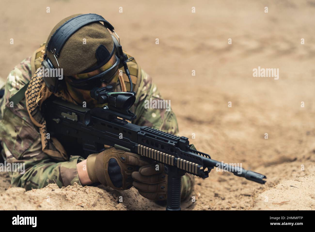 Accurate scoop aim by field veteran soldier on ground . High quality photo Stock Photo