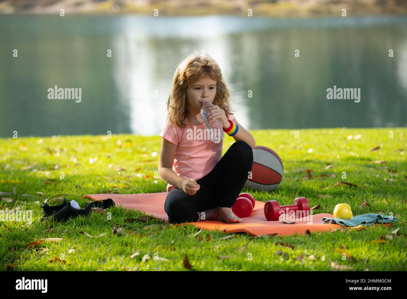 Sport kids boy. Healthy sports eating for child. Kid boy after sports ...