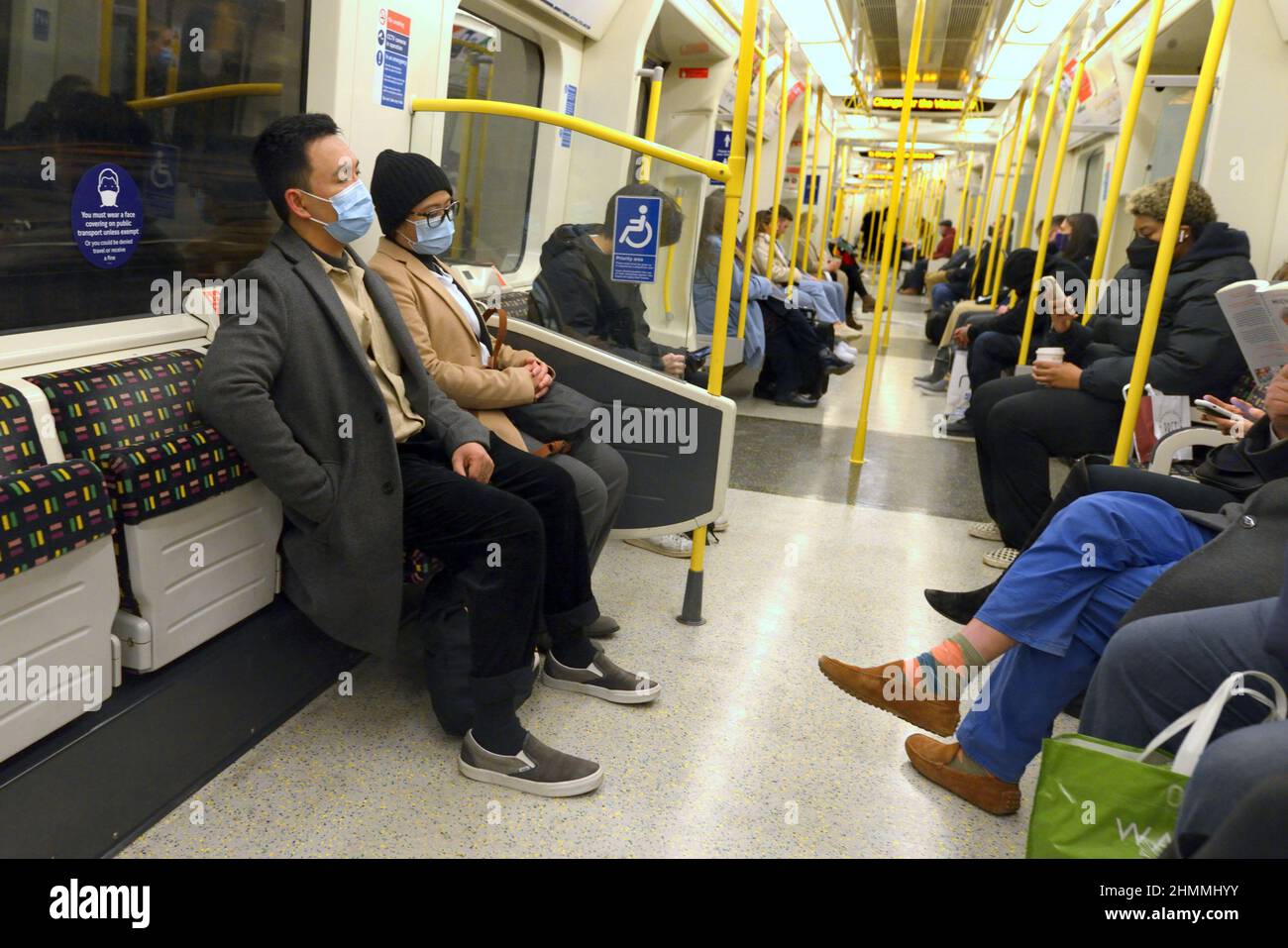 London, England, UK. London Underground passengers wearing COVID face