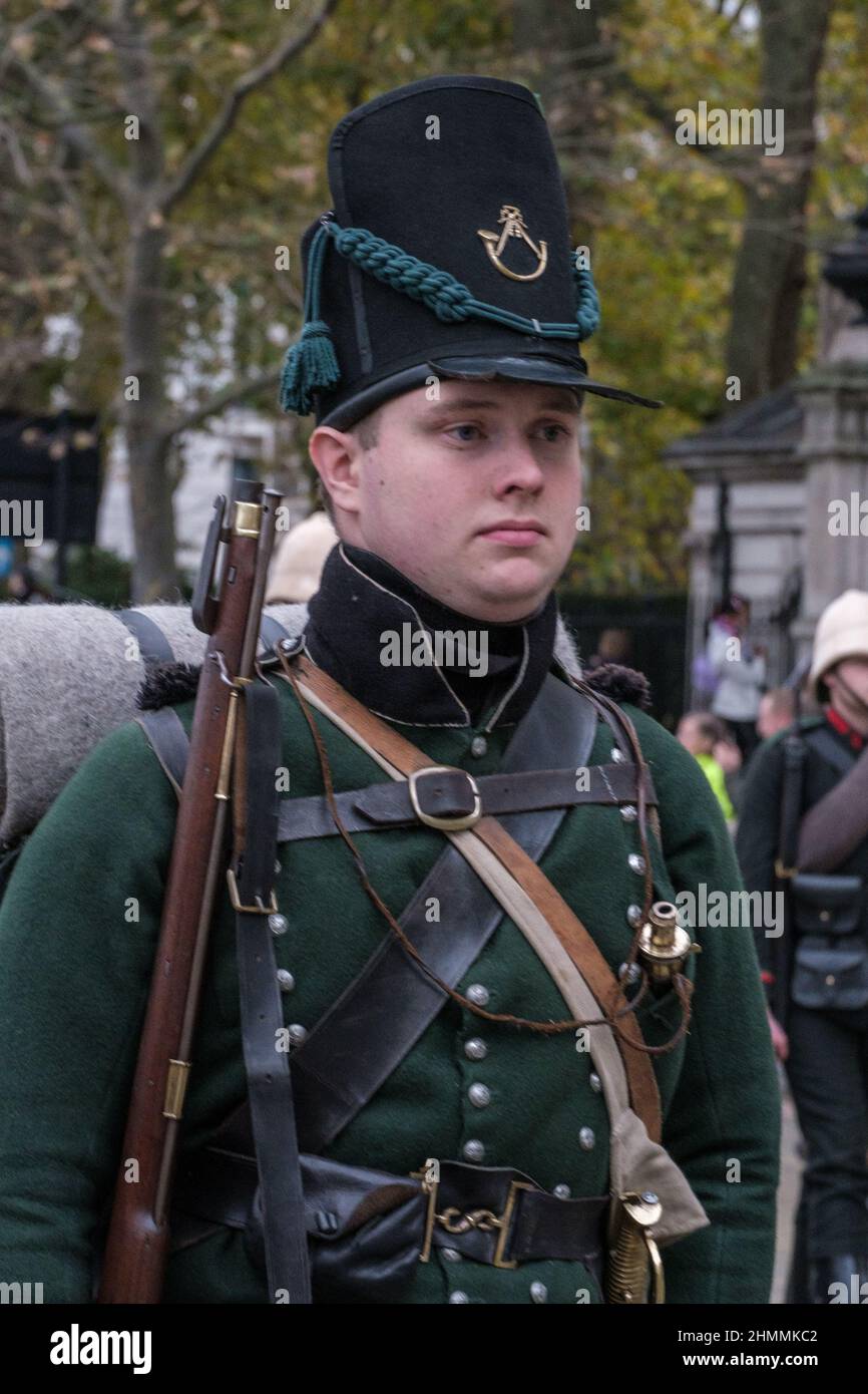 Reenactor dressed in Battle of Waterloo uniform looks ahead as he marches in the Lord Mayor’s show 2021, Victoria Embankment, London. Stock Photo