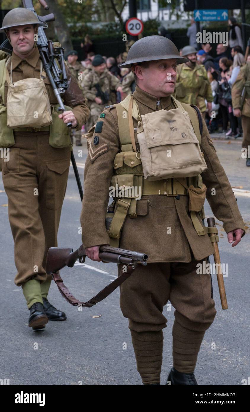 Men in World War 1 army uniforms with steel helmets and guns, in the Lord Mayor’s show 2021, Victoria Embankment, London. Stock Photo
