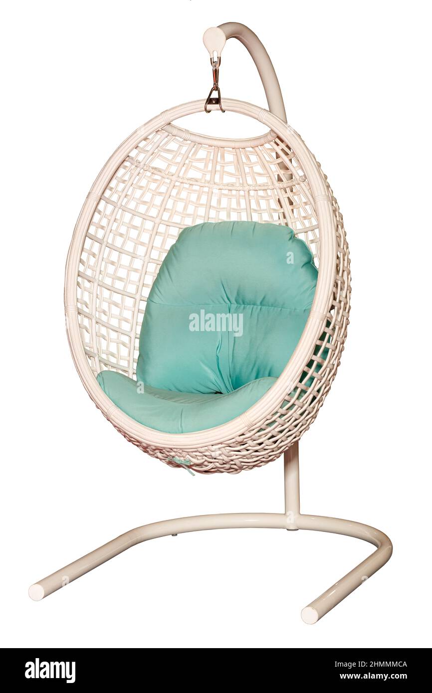 Hanging wicker chair nest with a soft green fabric seat isolated on a