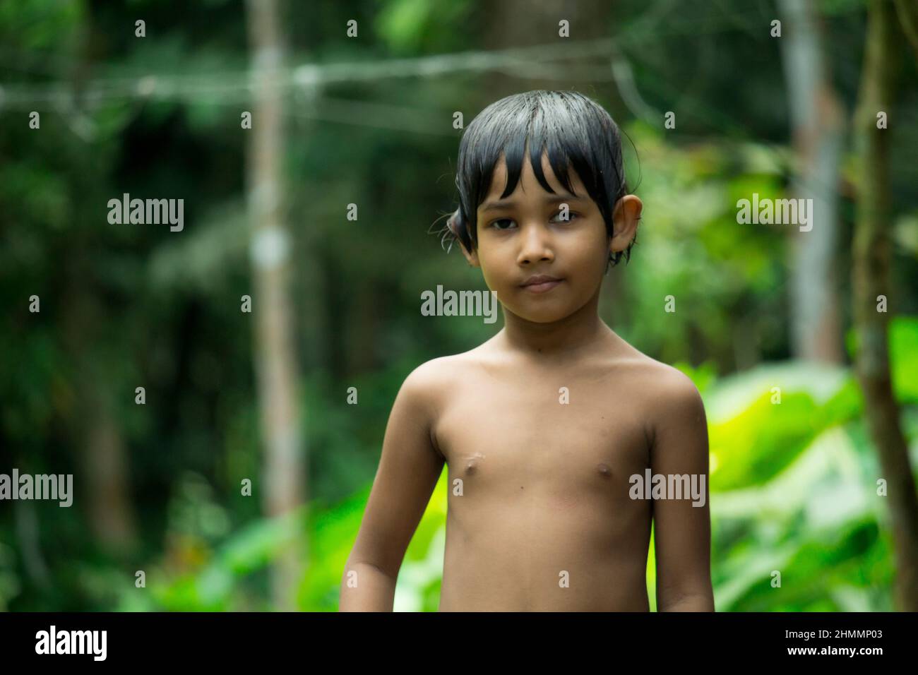 03-Oct-2021, Barisal, Bangladesh. Little baby on a green background Stock Photo