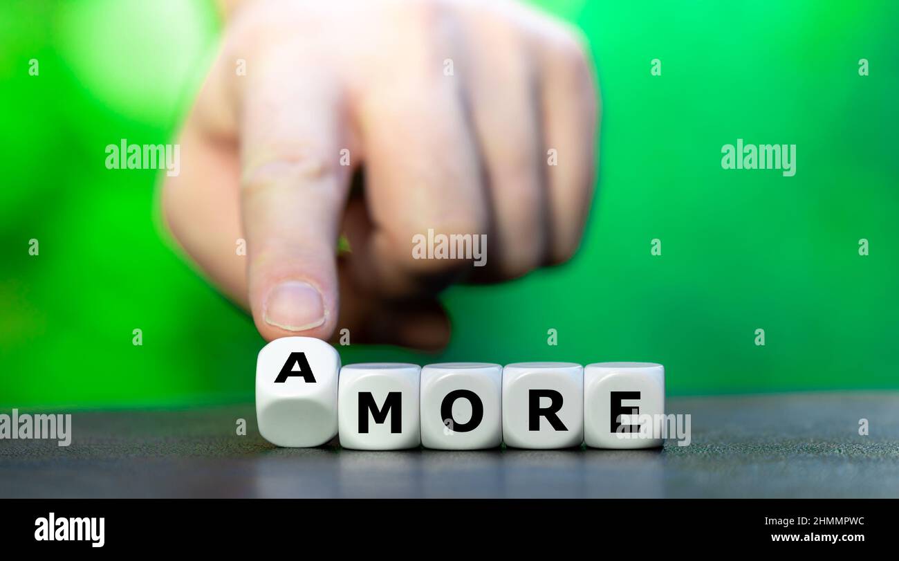 Dice form the expression 'more amore' (more love). Stock Photo