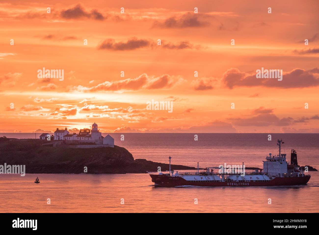 Roches Point, Cork, Ireland. 11th Feb, 2022. LPG tanker Gas Spirit passing the Roches Point lighthouse before dawn on her way to the National Oil Berth in Tivoli, Cork, Ireland. - Credit; Credit: David Creedon/Alamy Live News Stock Photo