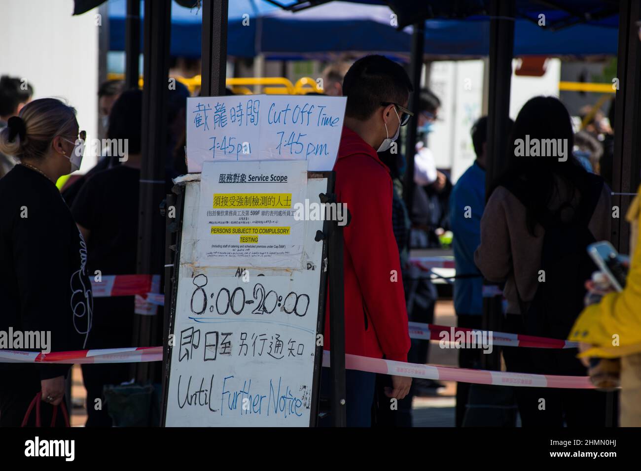 Hong Kong, China. 11th Feb, 2022. A board advises the opening times at a COVID temporary testing centre in Edinburgh Place in Central Hong Kong. Credit: Marc R. Fernandes /Alamy Live News Stock Photo
