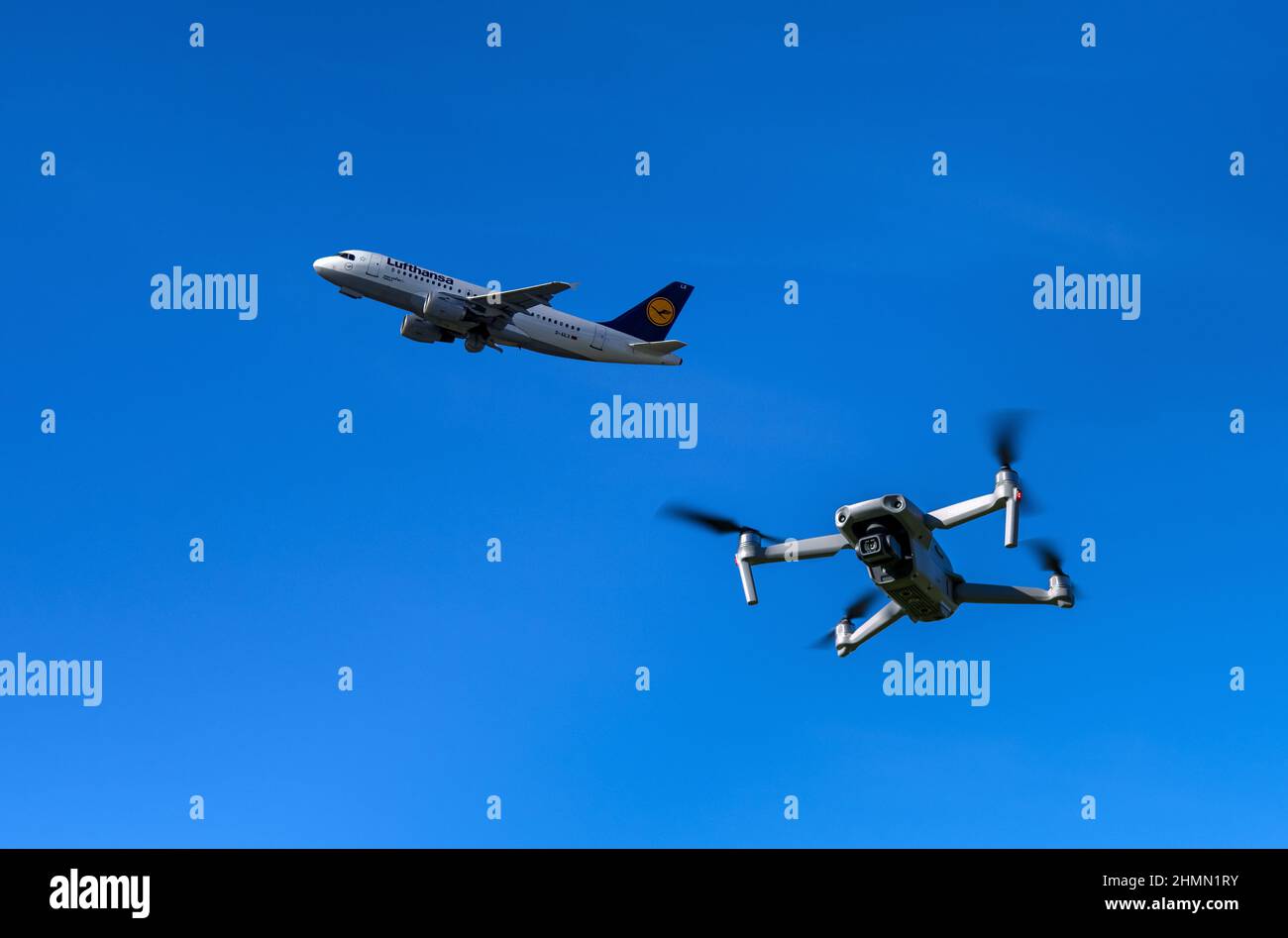 photo drone and a taking-off aircraft Airbus A300 together in the airspace, composing, Germany Stock Photo