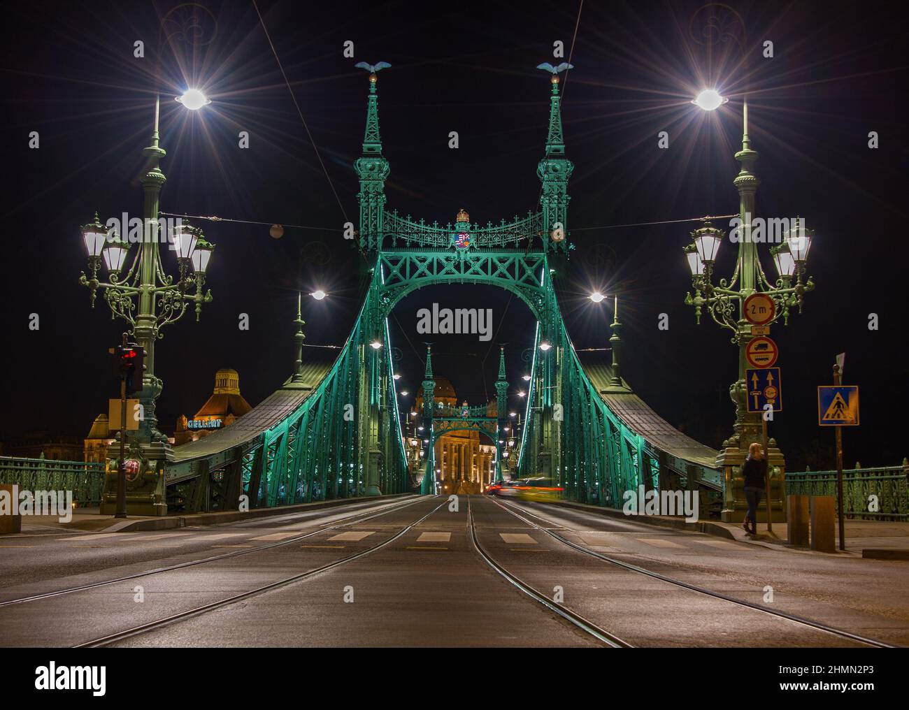 Elegant Liberty Bridge connecting the banks of Budapest in the night illumination, connects Buda and Pest across the River Danube. Stock Photo