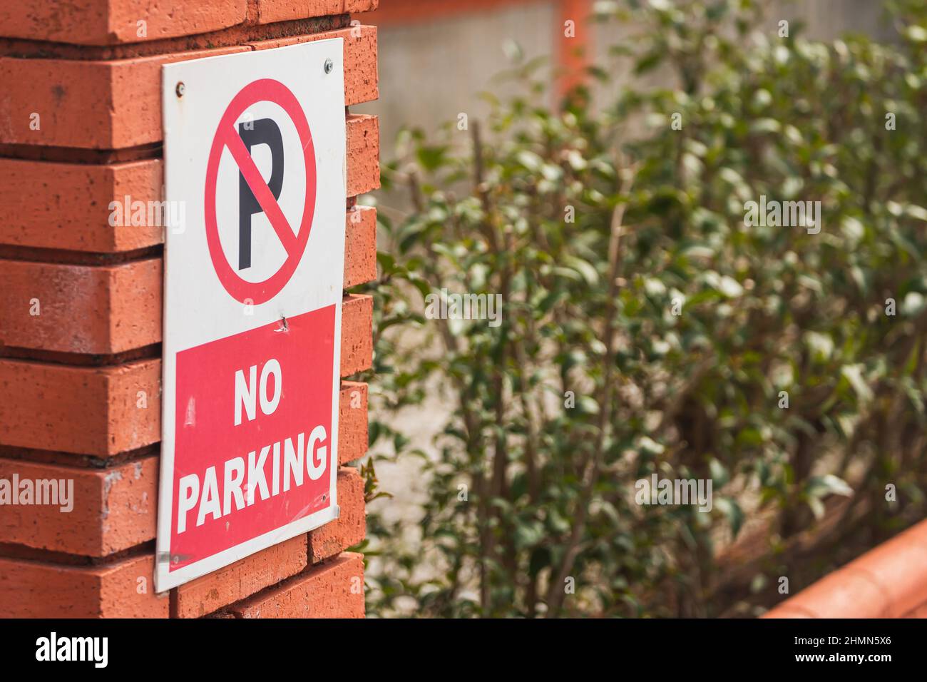 Close-up No parking sign on city background Stock Photo - Alamy
