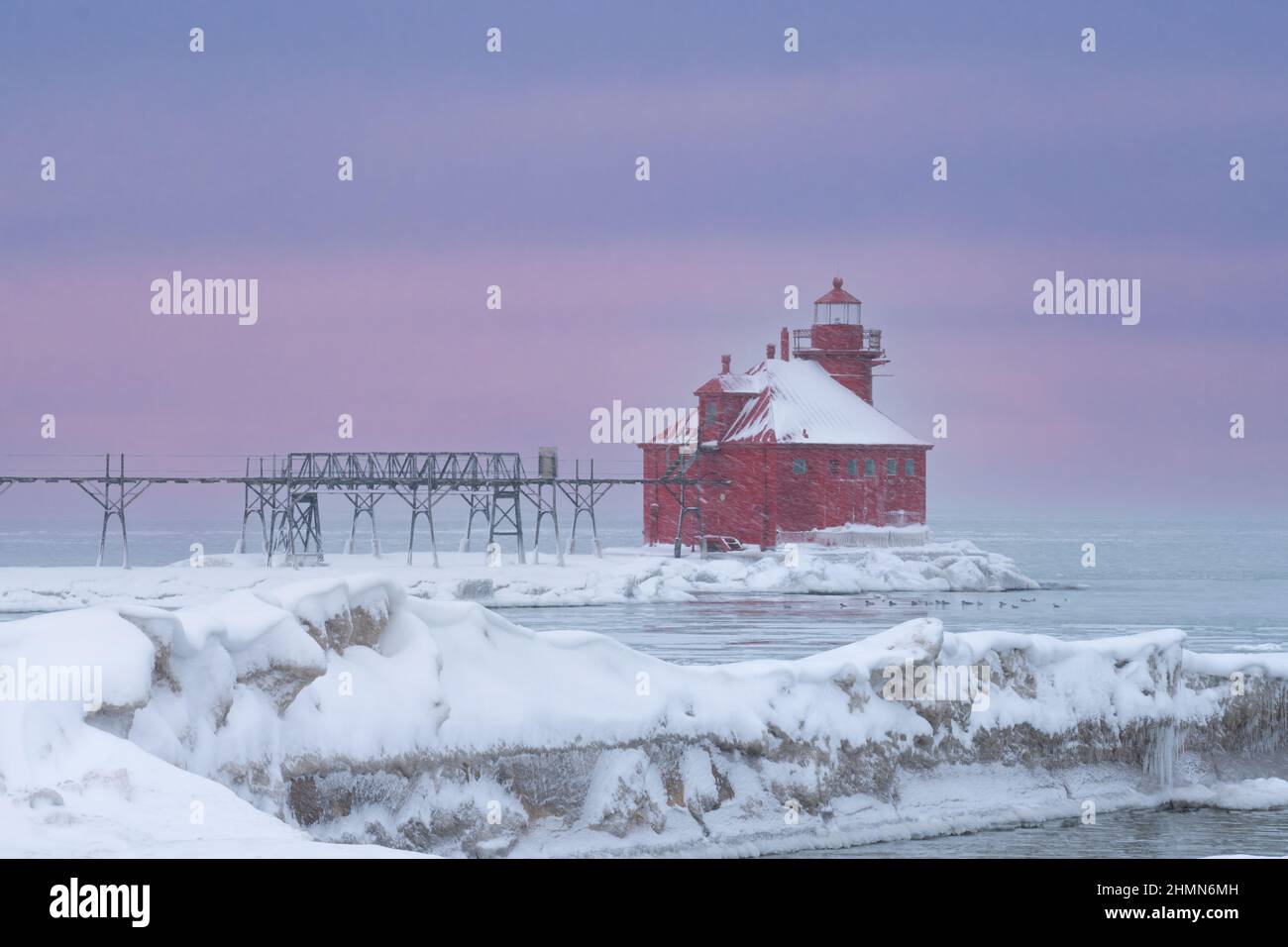 This winter image is of the Lake Michigan lighthouse at the east entrance of the shipping canal located near Sturgeon Bay Wisconsin a popular spot. Stock Photo