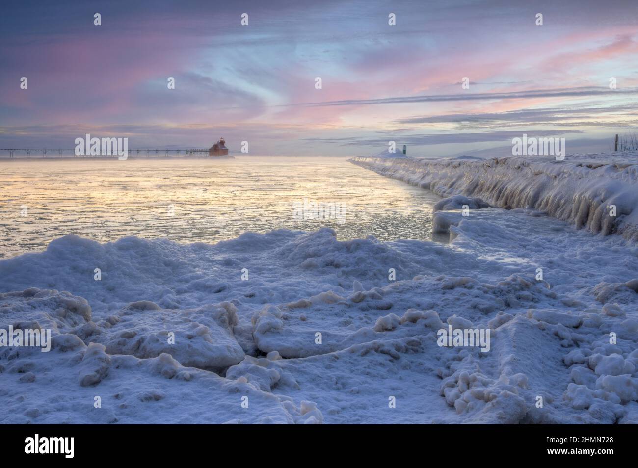 This winter image is of the Lake Michigan lighthouse at the east entrance of the shipping canal located near Sturgeon Bay Wisconsin a popular spot. Stock Photo
