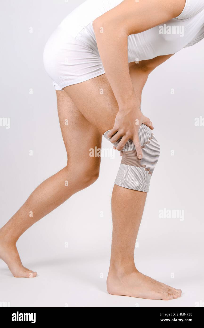 Knee Support Brace on leg isolated on white background. Elastic