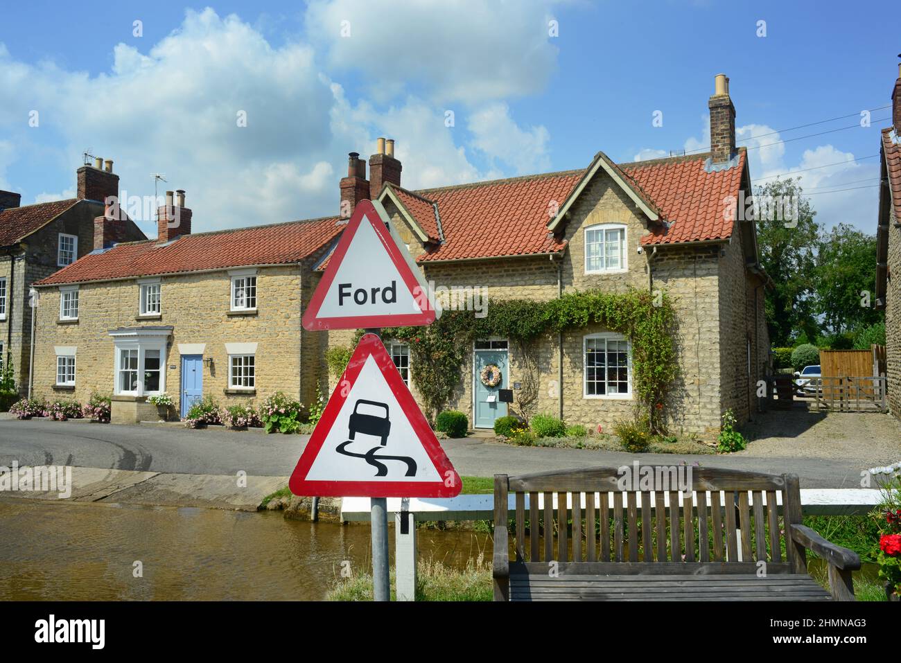 ford warning sign at Marr's beck by cottages in the village of hovingham north yorkshire moors united kingdom Stock Photo