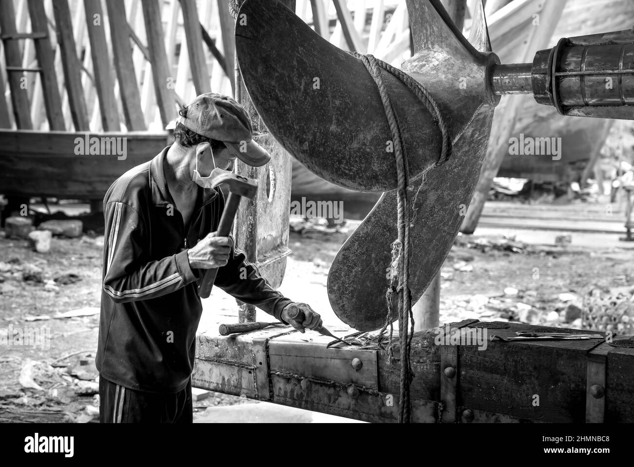 Tam Quan Shipyard, Binh Dinh Province, Vietnam - January 1, 2022: Workers are repairing ships at Tam Quan Shipyard, Binh Dinh, Vietnam Stock Photo