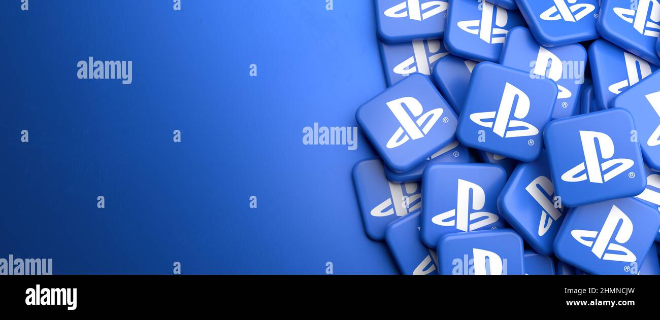 Logos of the home video game console Sony PlayStation on a heap on a table. Copy space. Web banner format. Stock Photo