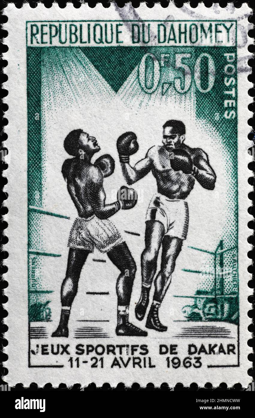Boxers in a match on vintage african stamp Stock Photo