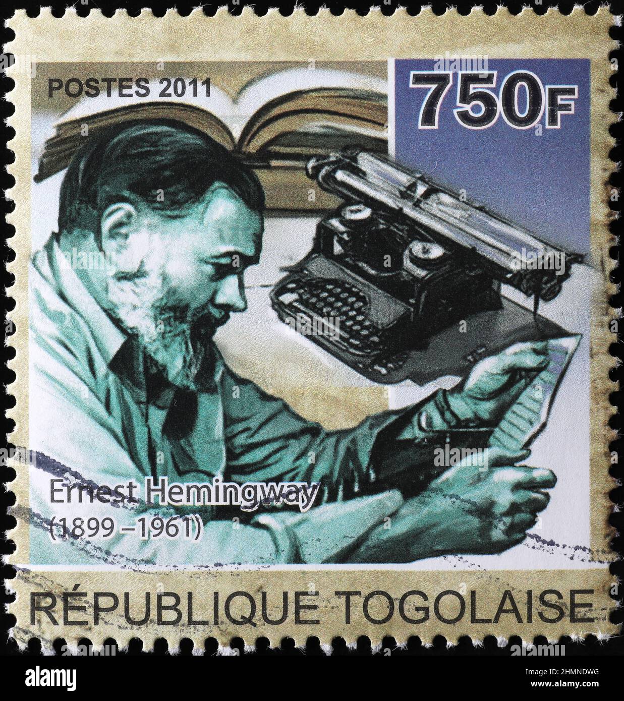 Ernest Hemingway and his typewriter on postage stamp Stock Photo