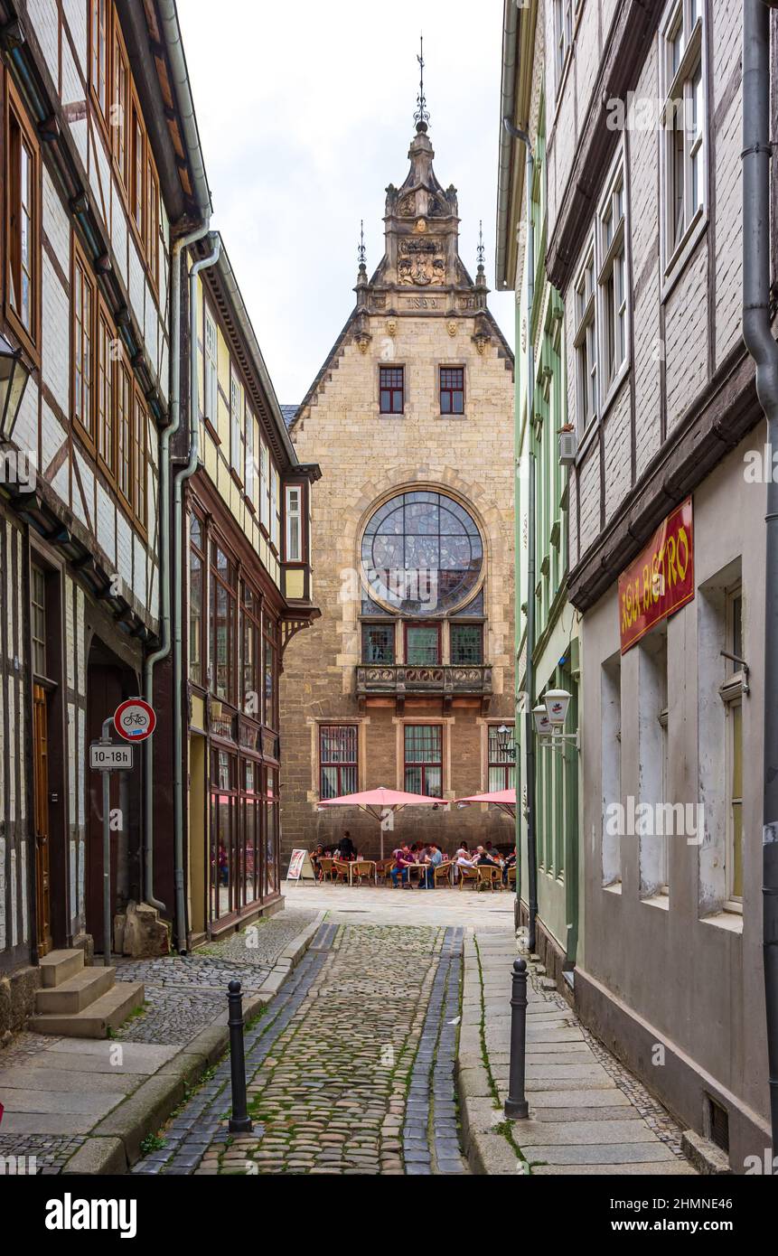 View down the narrow lane of Stieg to the East gable of the old medieval town hall of Quedlinburg, Saxony-Anhalt, Germany. Stock Photo