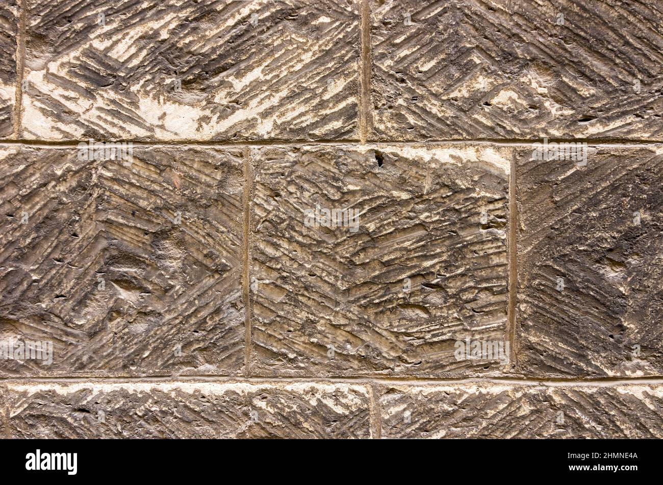 Texture of stone blocks of an exterior house wall. Stock Photo