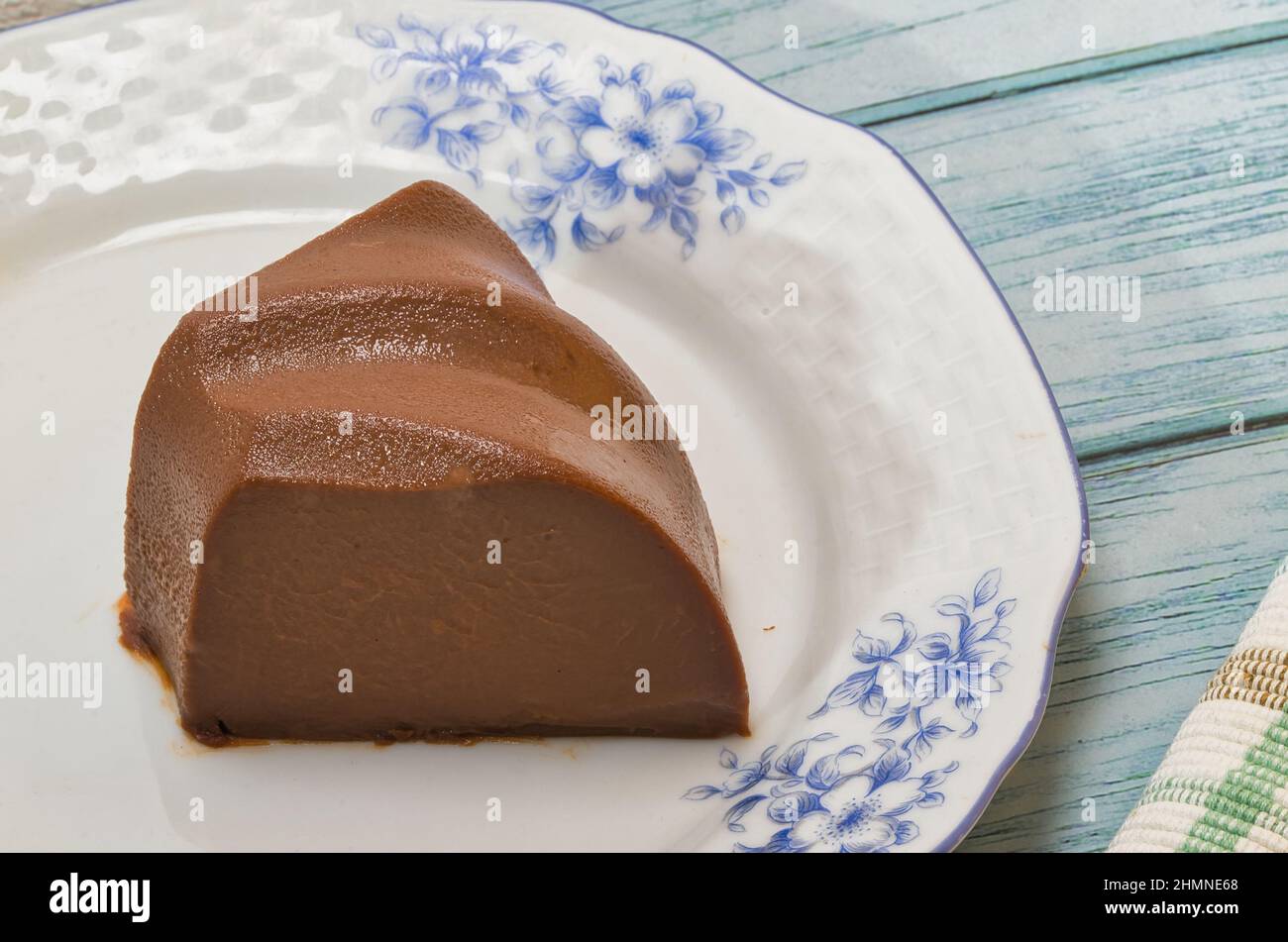 Fresh homemade cocoa pudding with organic milk and organic cocoa. A typical traditional dessert. Tasty, healthy and nutritious breakfast or snack. Stock Photo
