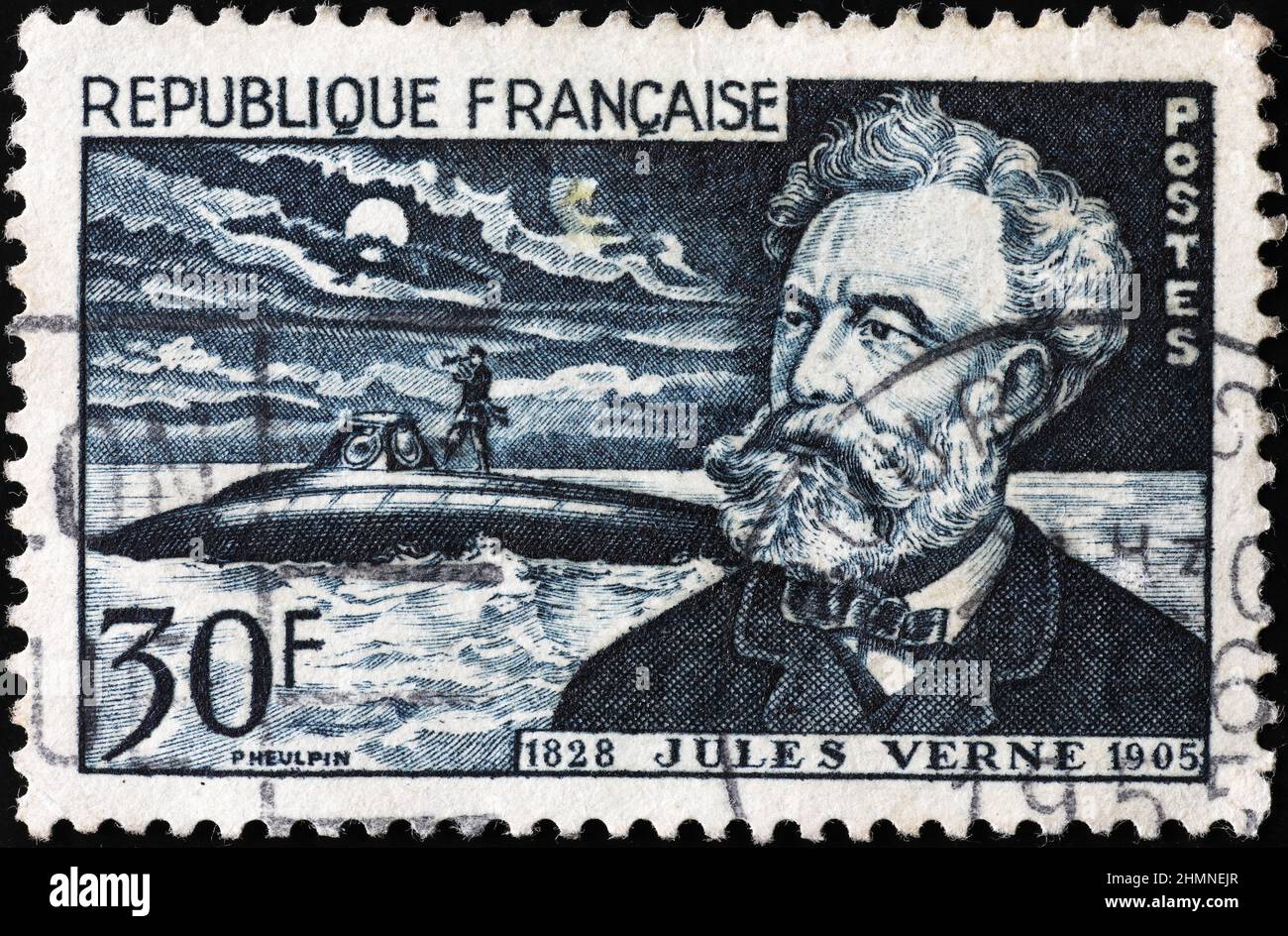 Jules Verne portrait on vintage postage stamp Stock Photo